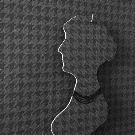 A Black And White Photo Of A Woman S Head With Hair Pinned To The Wall