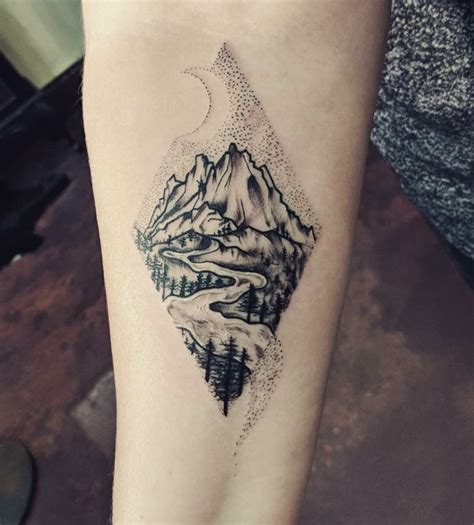 Showcase your adventurous spirit with a mountain range tattoo