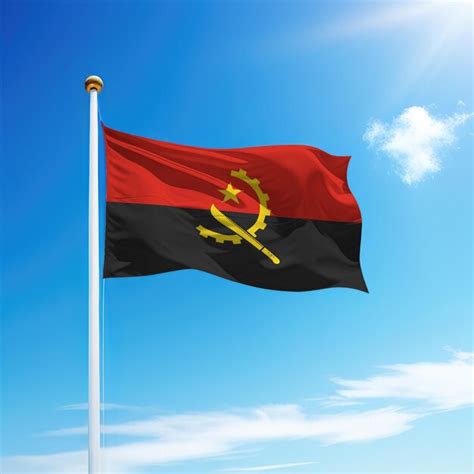 Premium Photo Waving Flag Of Angola On Flagpole With Sky Background