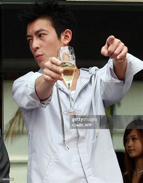 Hong Kong Pop Star Come Actor Edison Chen Gestures After Launching A