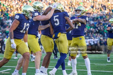 Tobias Merriweather Of Notre Dame Is Congratulated By His Teammates