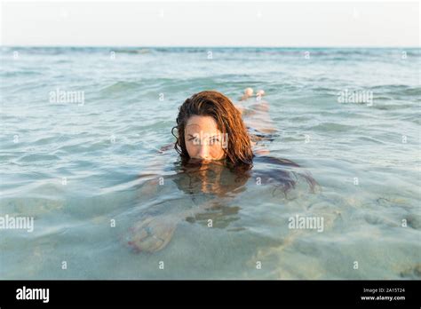 Young Woman Lying In Water Stock Photo Alamy