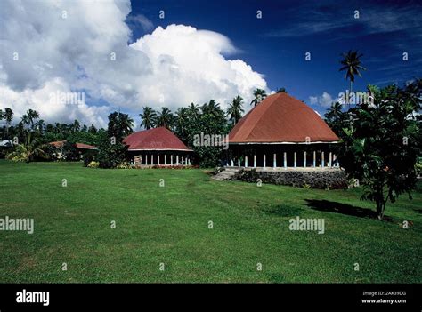 Traditional Samoan houses, the so-called fales, stand on an island of ...