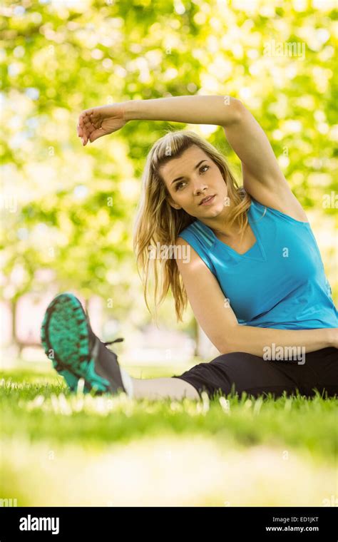 Fit Blonde Stretching In The Park Stock Photo Alamy