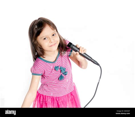 Asian female child singing with a microphone Stock Photo - Alamy