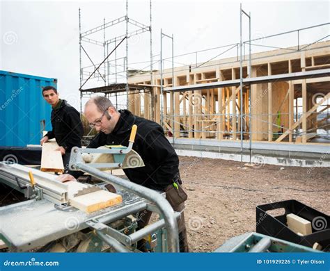 Carpenters Cutting Wood Using Table Saw At Site Stock Photo Image Of