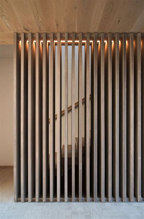 A Room With Wooden Slats On The Wall And Flooring In Front Of It