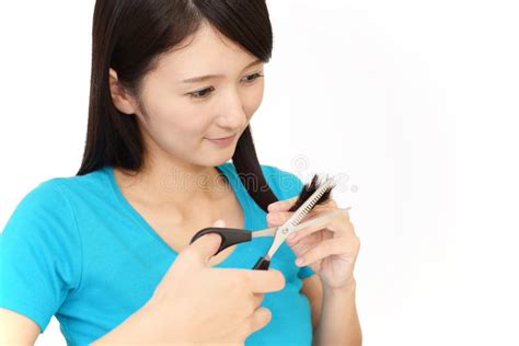 Woman Cutting Own Hair with Scissors Stock Photo - Image of joyful, hair: 143303160