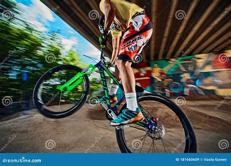 Mountain Bike Cyclist Doing Wheelie Stunt on a Mtb Bike Editorial Stock Image - Image of action ...