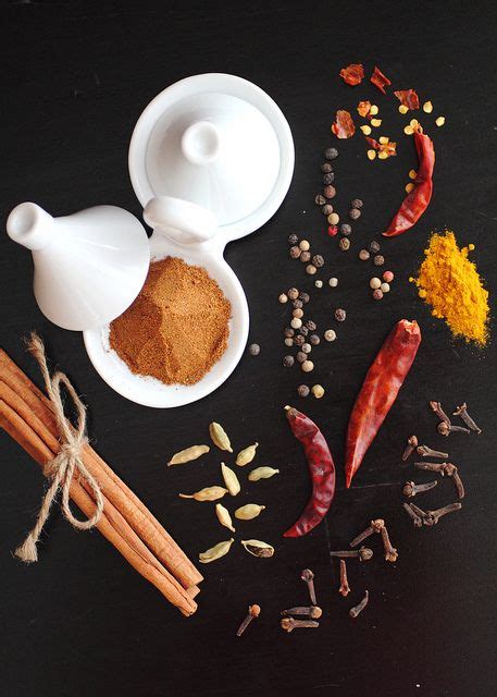 Spices And Spice On A Black Surface With White Bowls Spoons And