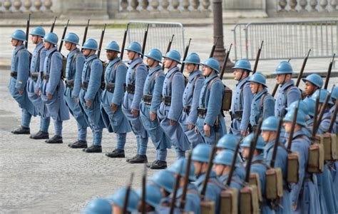 French Soldiers Wearing First World War Era Uniforms Parade On The