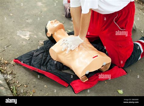 CPR training heart massage Stock Photo - Alamy