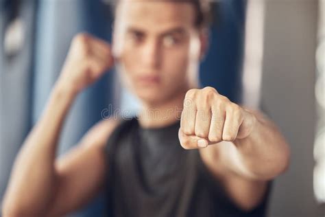 Closeup On The Hand Of An Athlete Boxer Punching In The Gym Strong