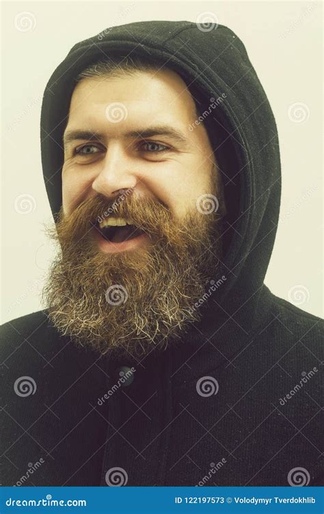 Bearded Happy Brutal Caucasian Man In Black Jacket And Hood Stock Image