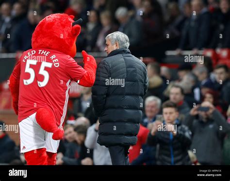 Manchester United mascot Fred The Red talks to manager Jose Mourinho ...