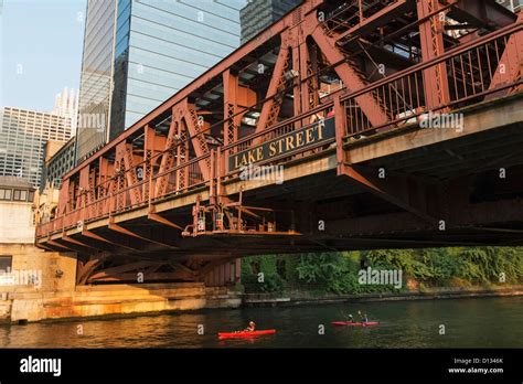 Kayakers In The Chicago River Paddling Under Lake Street Bridge