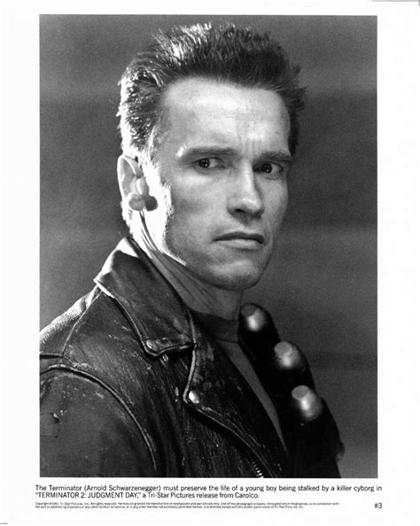 A Black And White Photo Of A Man In Leather Jacket