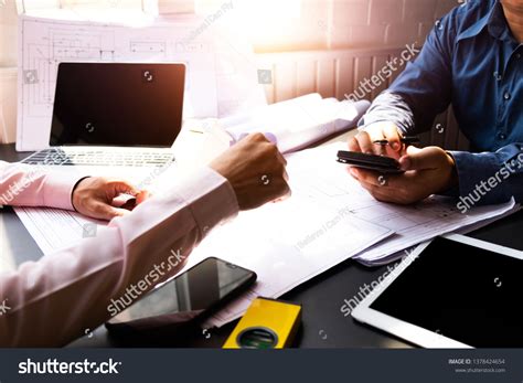 Engineers Pointing Building On Blueprint Using Stock Photo 1378424654