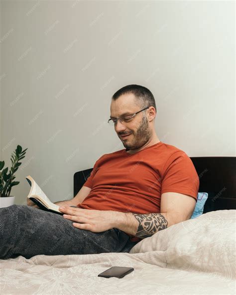 Free Photo | Man reading on bed