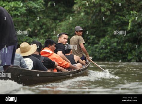 Nicholas Saputra, an Indonesian actor and film producer, on a wooden ...