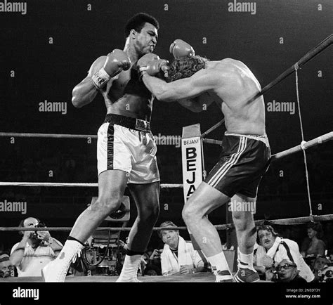 Britain S Joe Bugner Covers Up As Muhammad Ali Rains Punches On Him In