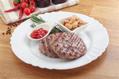 Premium Photo Grilled Beef Burger Cutlet With Sauce And Beans