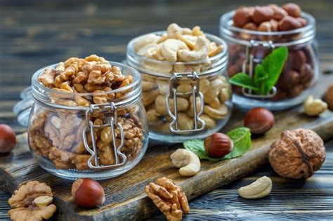 Premium Photo Glass Jars With Walnuts Cashews And Hazelnuts