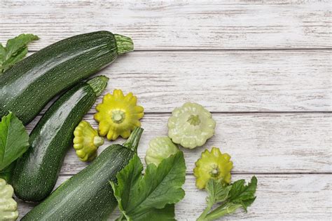 Premium Photo Green Squash With Leaves And Small Pattypan Squash