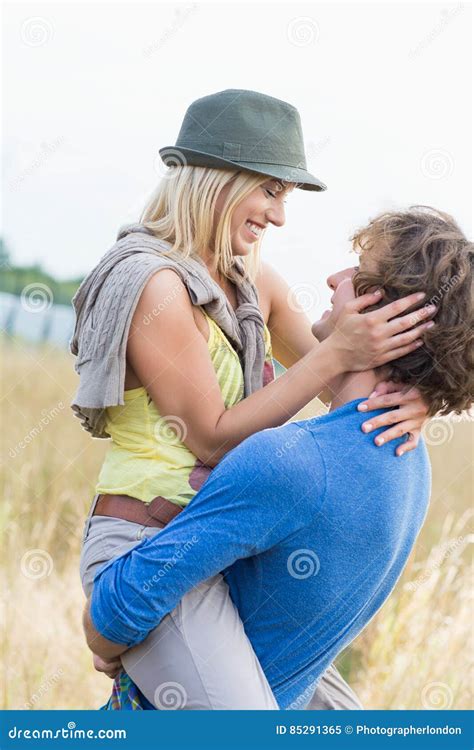 Romantic Man Carrying Woman In Field Stock Image Image Of Field