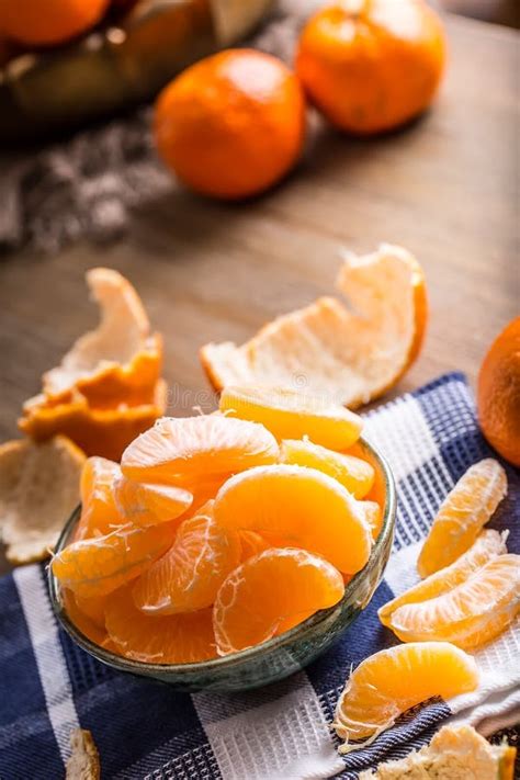 Tangerines Peeled Tangerine And Tangerine Slices On A Blue Cloth