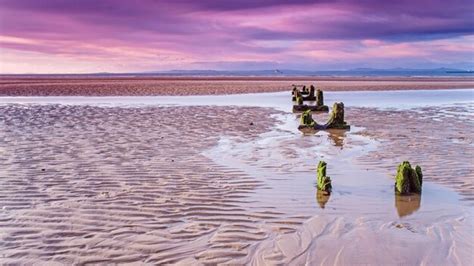 Premium Photo Reflection Of Man In Sea Water Against Sky