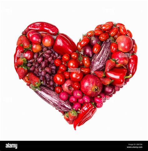 Heart of red fruits and vegetables isolated on a white background Stock ...