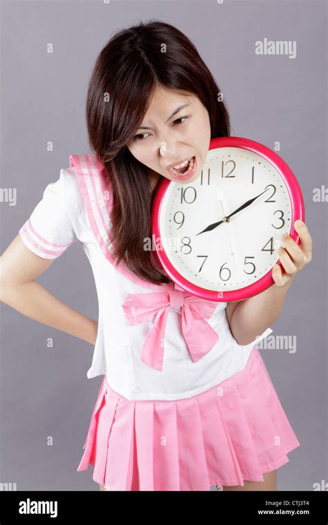 School girl plays clock Stock Photo - Alamy