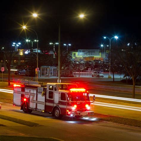 Fire Truck with Emergency Lights Driving at Night Stock Photo - Image ...