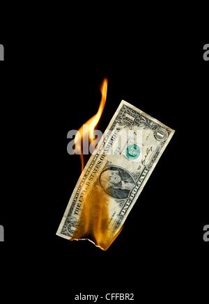 Burning Dollar Bill Symbolizing Careless Money Management And The