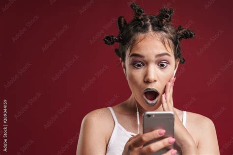 Image Of Surprised Punk Girl With Bizarre Hairstyle And Dark Lipstick