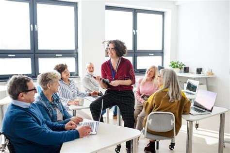 Group Of Senior People Attending Computer And Technology Education