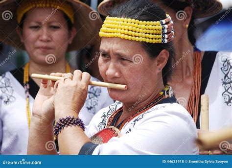 Blowing a bamboo flute editorial stock photo. Image of ethnicity - 44621918