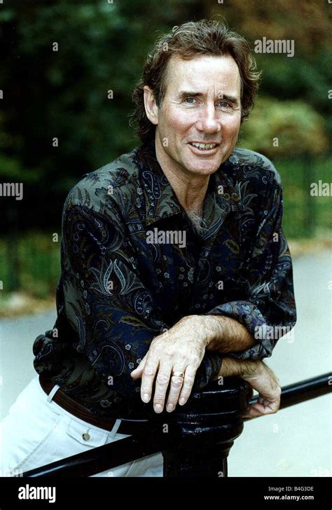 Jim Dale British Comedy Actor Wearing Patterned Shirt Leaning On Metal