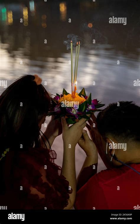 Praying For A Candle During Loy Krathong Festival In Chiang Mai