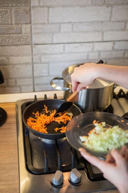 Premium Photo Carrot And Onion On Frying Pan