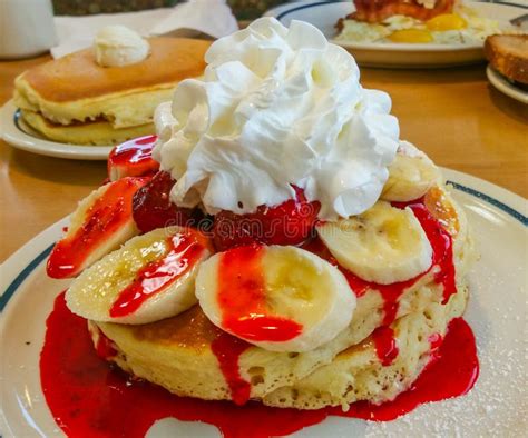 Delicious American Pancakes with Bananas Strawberry Sauce and Whipped ...