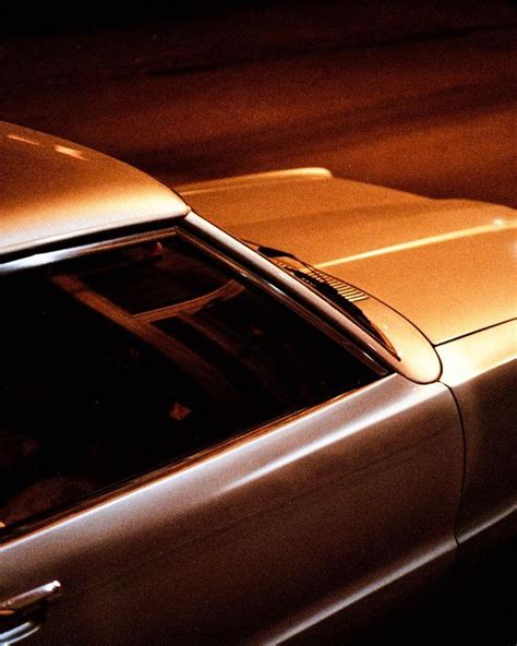 A Car Parked On The Street At Night