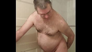 Nude Martin Lavallée sodomizes himself and compares his dildo with his small caged penis