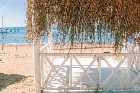 Massage Huts With Thatched Roof On Sand Beach Along Seaside Luxury