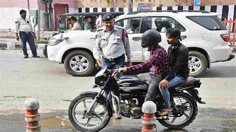 Delhi Fined For Not Wearing Helmet Youth Runs Away With Challan Machine