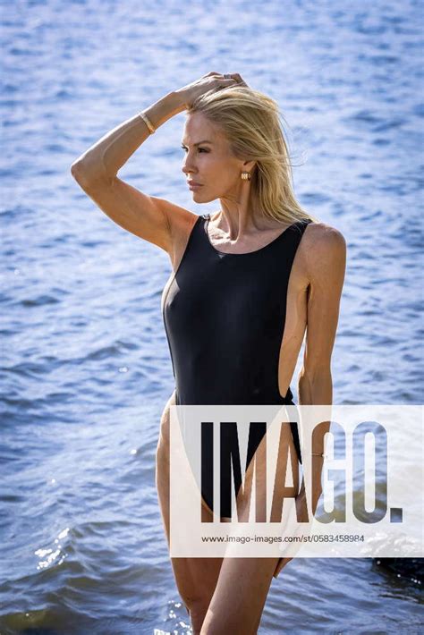 Sunlit Elegance Mature Bikini Model Flaunts Curves And Beauty In Stunning Outdoor Photoshoot A