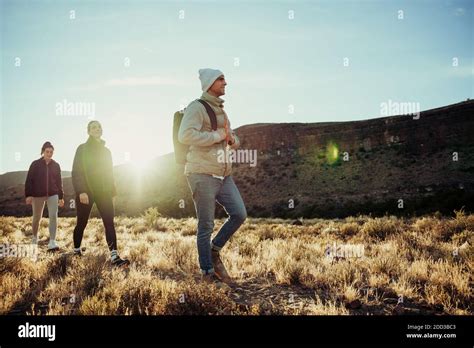 Group of teenagers walking through mountain setting enjoying fresh air
