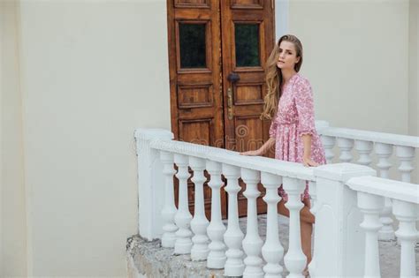 Beautiful Blonde Woman Walking By The Railing On The Street Stock Image Image Of Lifestyle