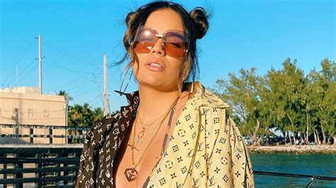 Karol G Enjoys Sun And Shows Off Her Curves In A Red Bikini